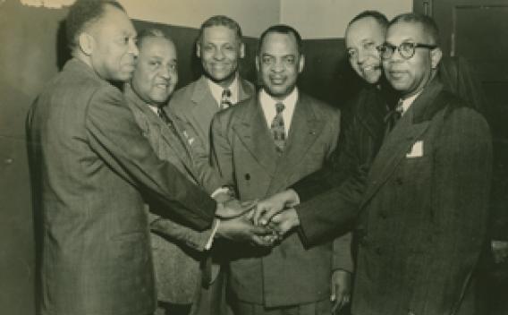 Archival footage of business men