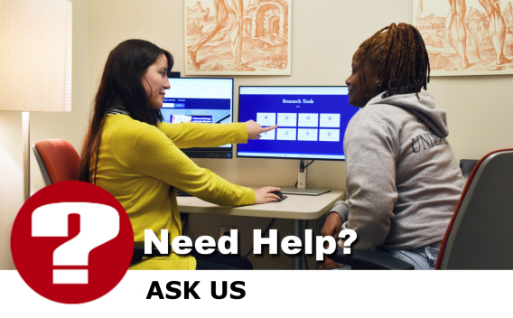 Image: Librarian assisting a user