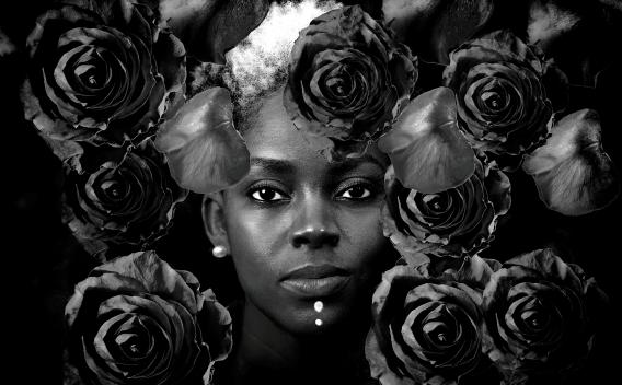 Black and white collage of a woman's face surrounded by roses